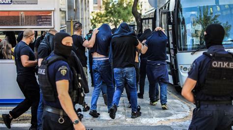 Dozens of Croatian soccer fans appear in court in Greece after deadly violence outside stadium